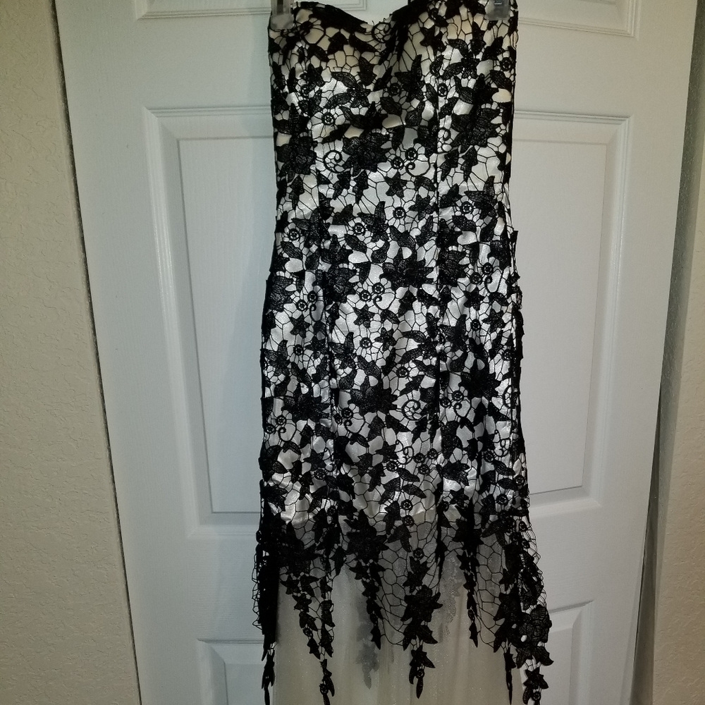 White and black strapless lace dress